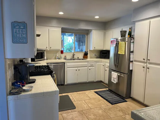 a view of a dining room with furniture and window