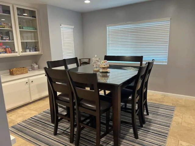 a living room with furniture and a rug