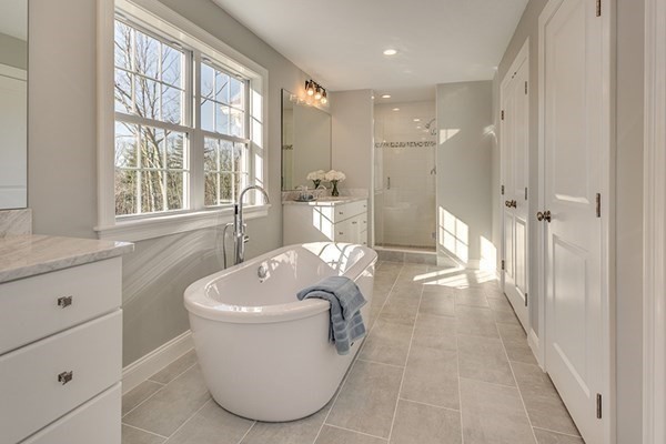 38 F Hiley Brook Road Stow, MA 01775 - Photo 11 of 26 a spacious bathroom with a bathtub sink and toilet