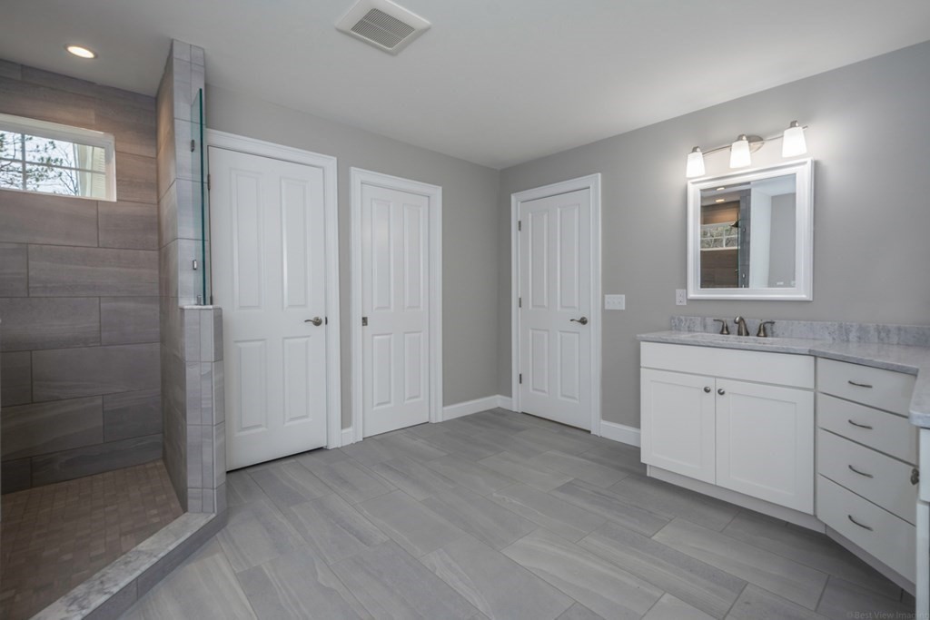 38 F Hiley Brook Road Stow, MA 01775 - Photo 12 of 26 a bathroom with a granite countertop sink mirror and double