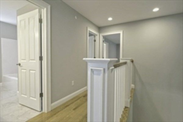 38 F Hiley Brook Road Stow, MA 01775 - Photo 14 of 26 a view of a hallway with wooden floor and entryway