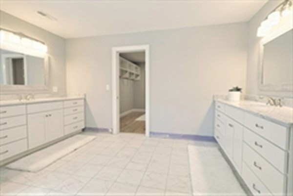 38 F Hiley Brook Road Stow, MA 01775 - Photo 17 of 26 a spacious bathroom with a double vanity sink a mirror and a