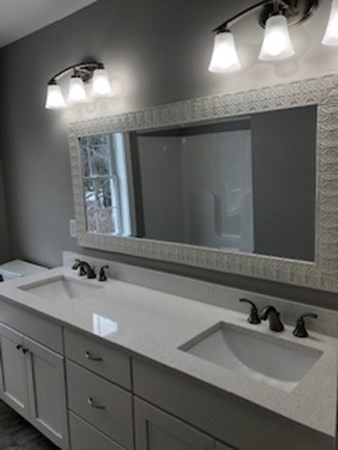 38 F Hiley Brook Road Stow, MA 01775 - Photo 19 of 26 a bathroom with a sink and a mirror
