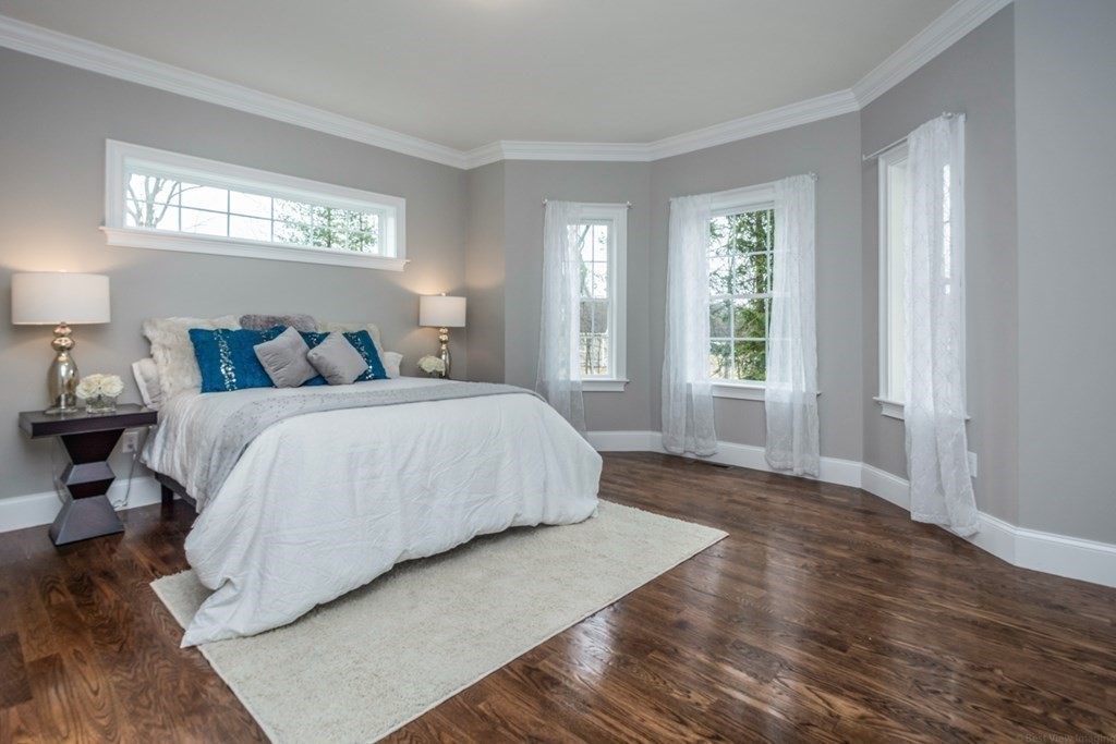 38 F Hiley Brook Road Stow, MA 01775 - Photo 9 of 26 a bedroom with a bed and a window