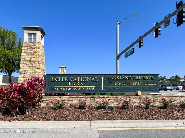 a view of a street with a building in the background