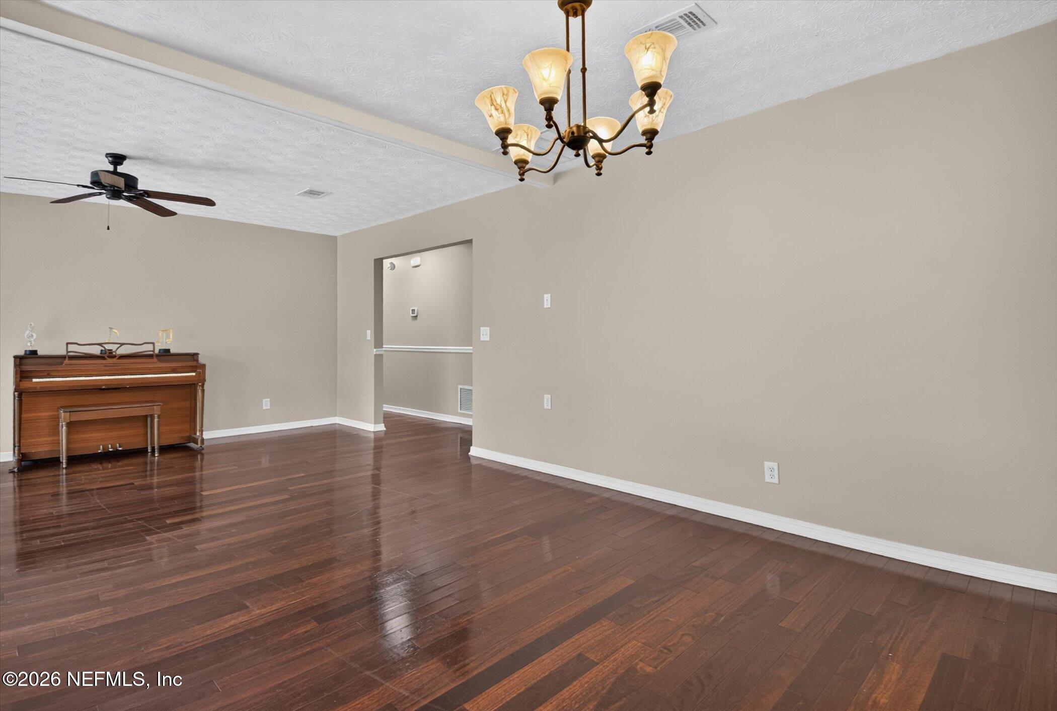 2705 Navajo Road Orange Park, FL 32073 - Photo 17 of 58 wooden floor in an empty room with a window