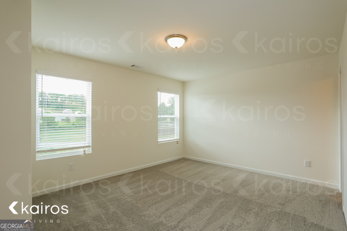 115 Dudley Way Southwest Cartersville, GA 30120 - Photo 11 of 16 an empty room with a window