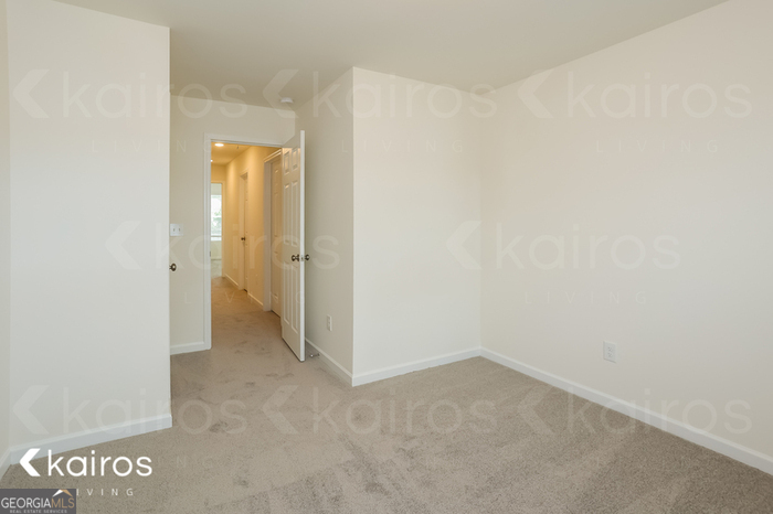 115 Dudley Way Southwest Cartersville, GA 30120 - Photo 13 of 16 an empty room with an entrance and door