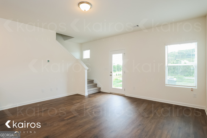 115 Dudley Way Southwest Cartersville, GA 30120 - Photo 2 of 16 an view of an empty room with stairs