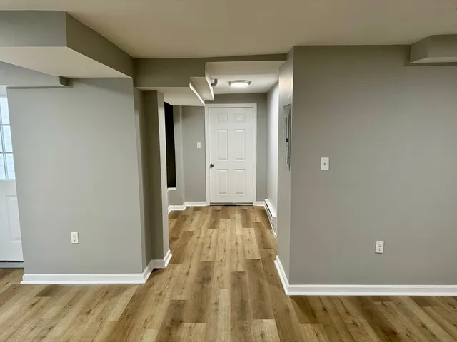 a view of an empty room and window