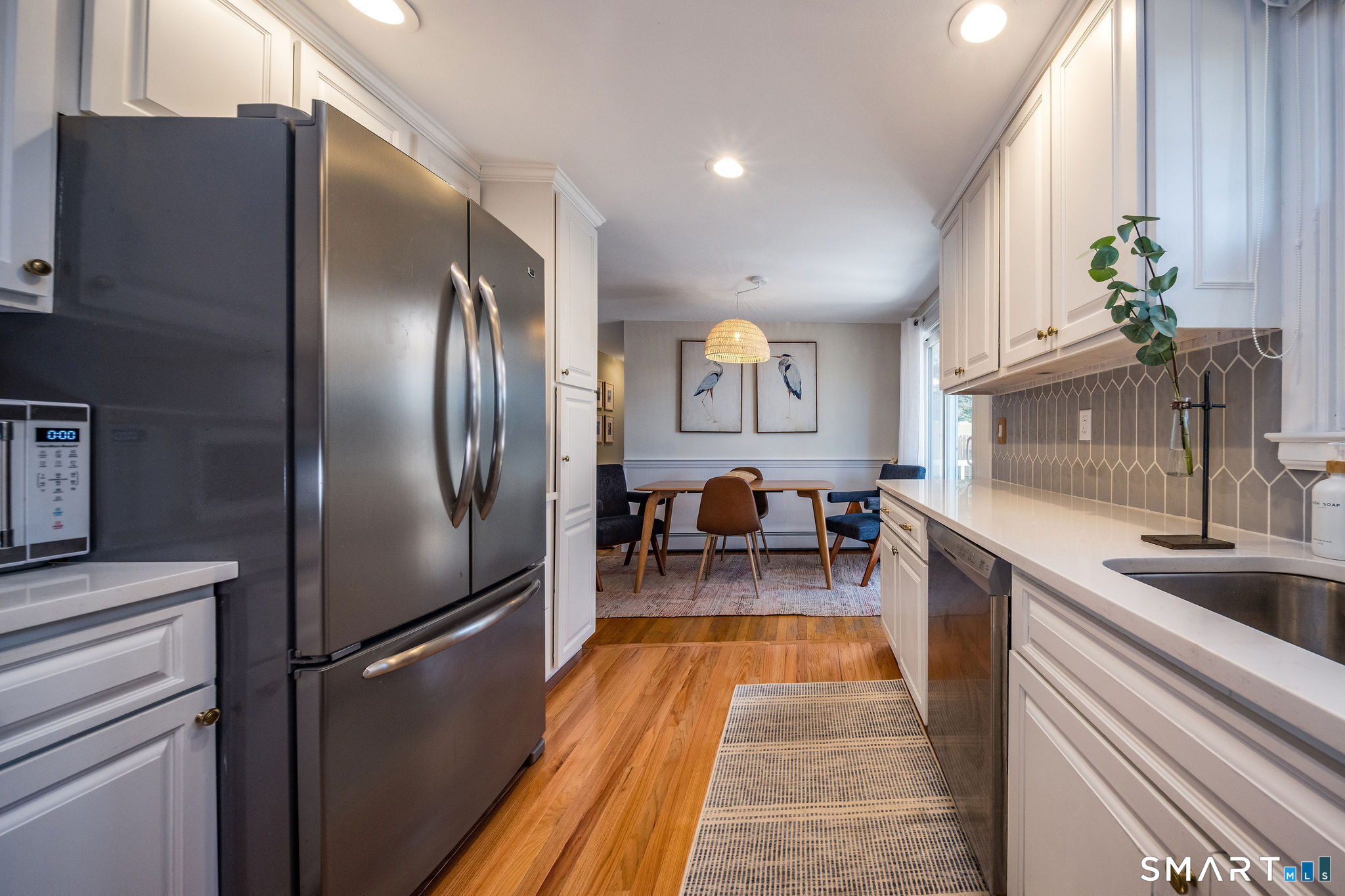 99 Maple Avenue Old Saybrook, CT 06475 - Photo 11 of 30 a view of a kitchen from the dinning room