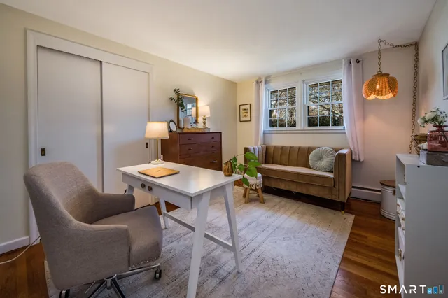 a living room with furniture and a window