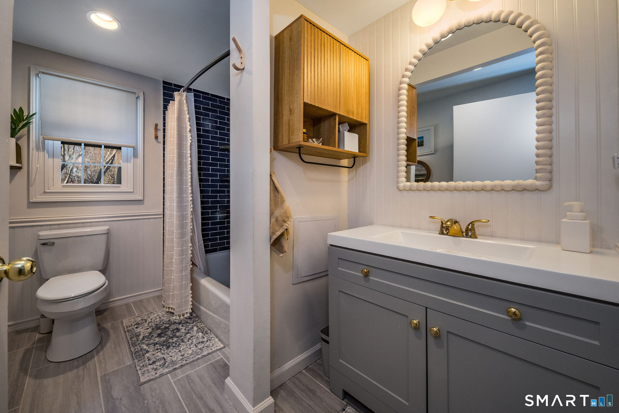 99 Maple Avenue Old Saybrook, CT 06475 - Photo 16 of 30 a bathroom with a sink a toilet and mirror