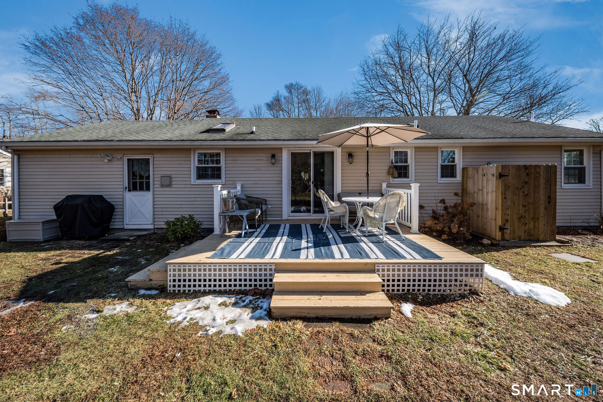 99 Maple Avenue Old Saybrook, CT 06475 - Photo 21 of 30 a view of a patio with furniture and a yard
