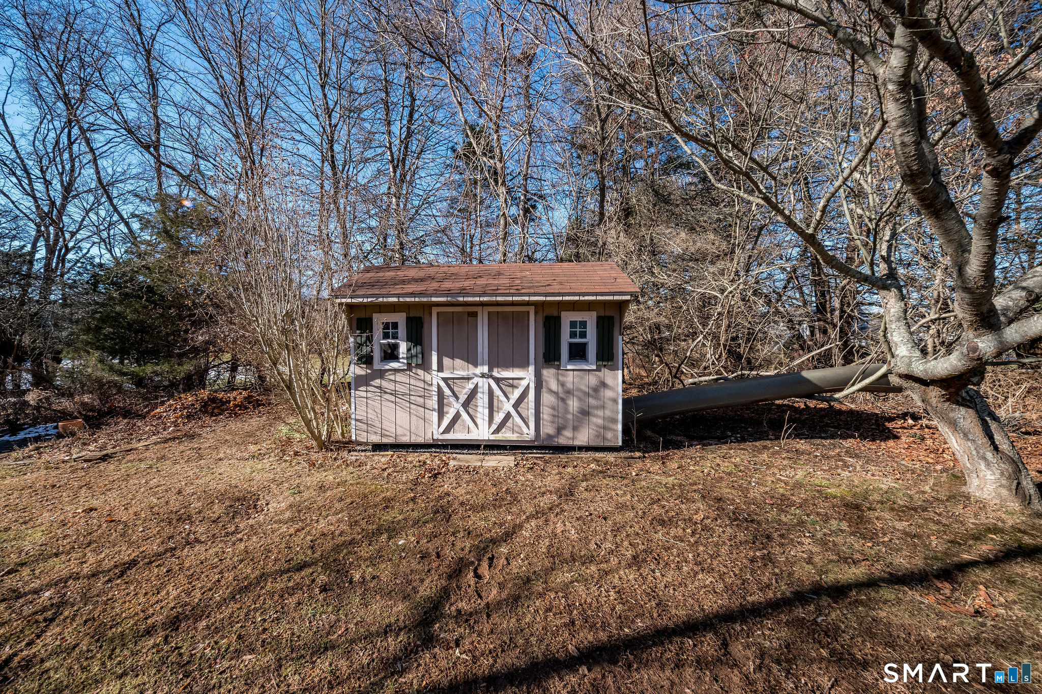 99 Maple Avenue Old Saybrook, CT 06475 - Photo 23 of 30 a view of a house with a yard