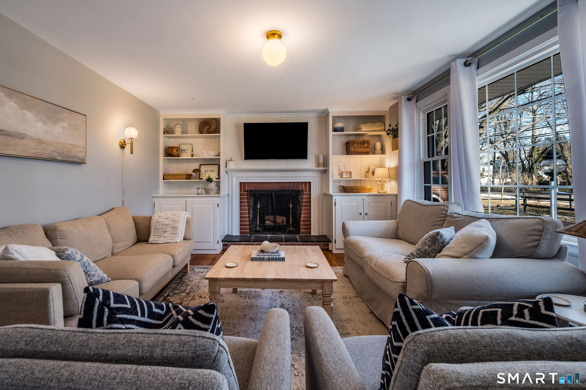 99 Maple Avenue Old Saybrook, CT 06475 - Photo 5 of 30 a living room with furniture fireplace and a flat screen tv