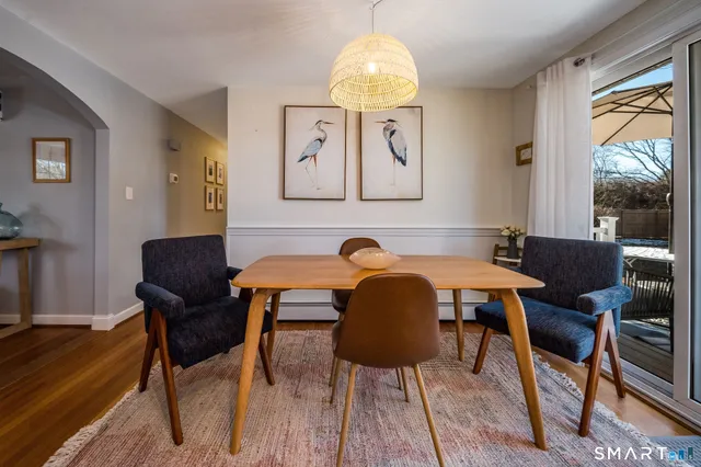 a view of a dining room with furniture window and outside view