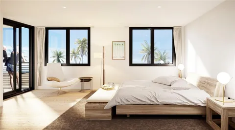 a bedroom with a large bed and a window