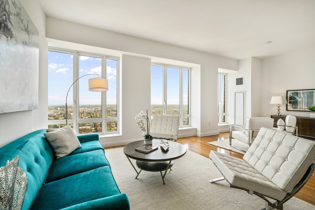 a living room with furniture and a large window