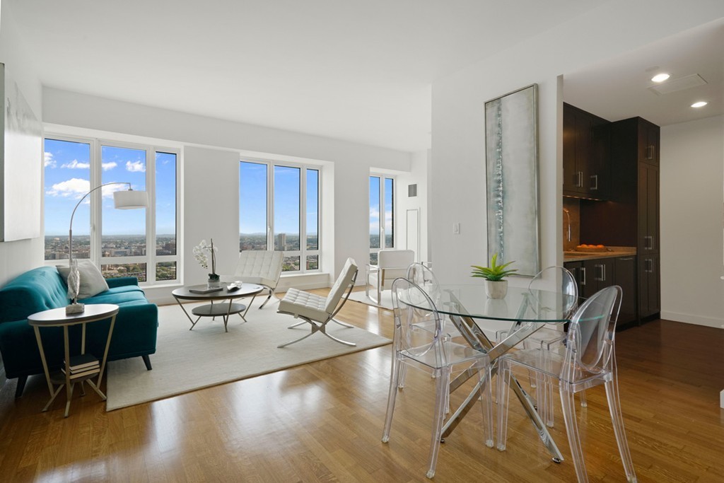 400 Stuart Street, Unit 29C Boston, MA 02116 - Photo 2 of 16 a living room with furniture and wooden floor