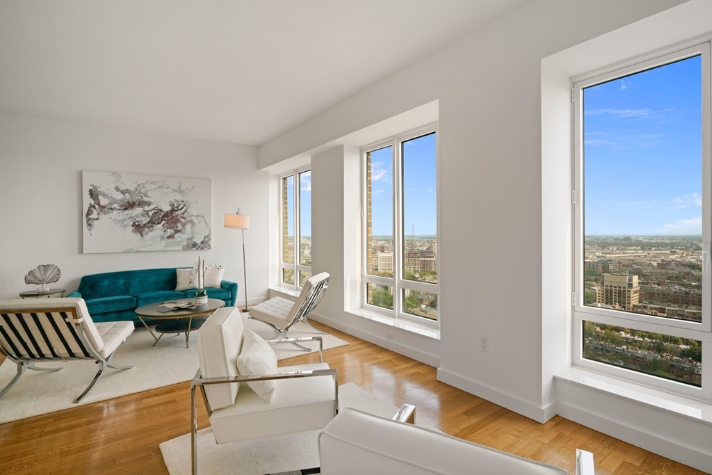 400 Stuart Street, Unit 29C Boston, MA 02116 - Photo 3 of 16 a living room with furniture and a large window