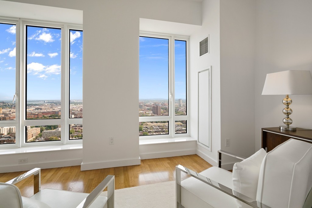 400 Stuart Street, Unit 29C Boston, MA 02116 - Photo 4 of 16 a living room with furniture and a window