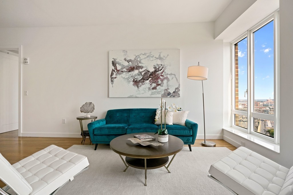 400 Stuart Street, Unit 29C Boston, MA 02116 - Photo 5 of 16 a living room with furniture and a large window