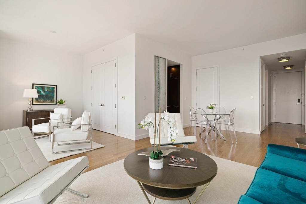 400 Stuart Street, Unit 29C Boston, MA 02116 - Photo 7 of 16 a living room with furniture and a table