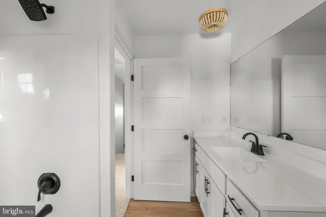 a bathroom with a sink and a shower