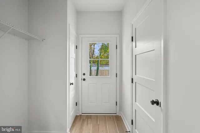 a view of bathroom with a bathtub a sink and mirror