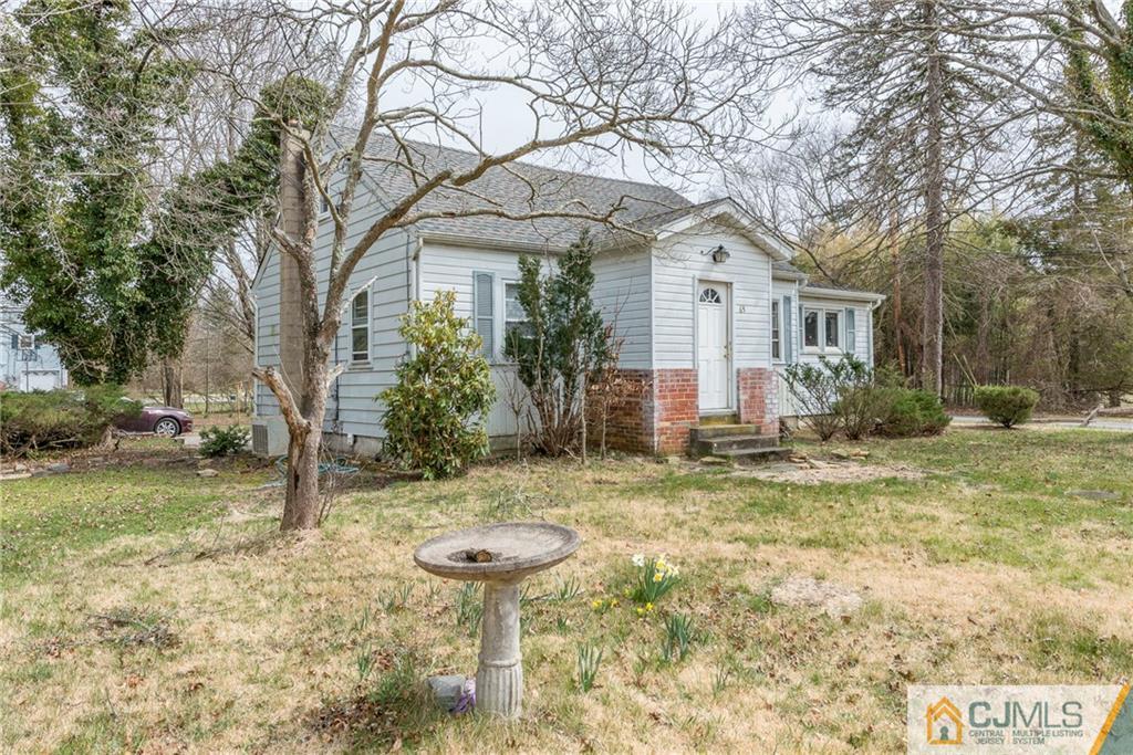 65 Ford Road Howell, NJ 07731 - Photo 2 of 22 a front view of a house with garden