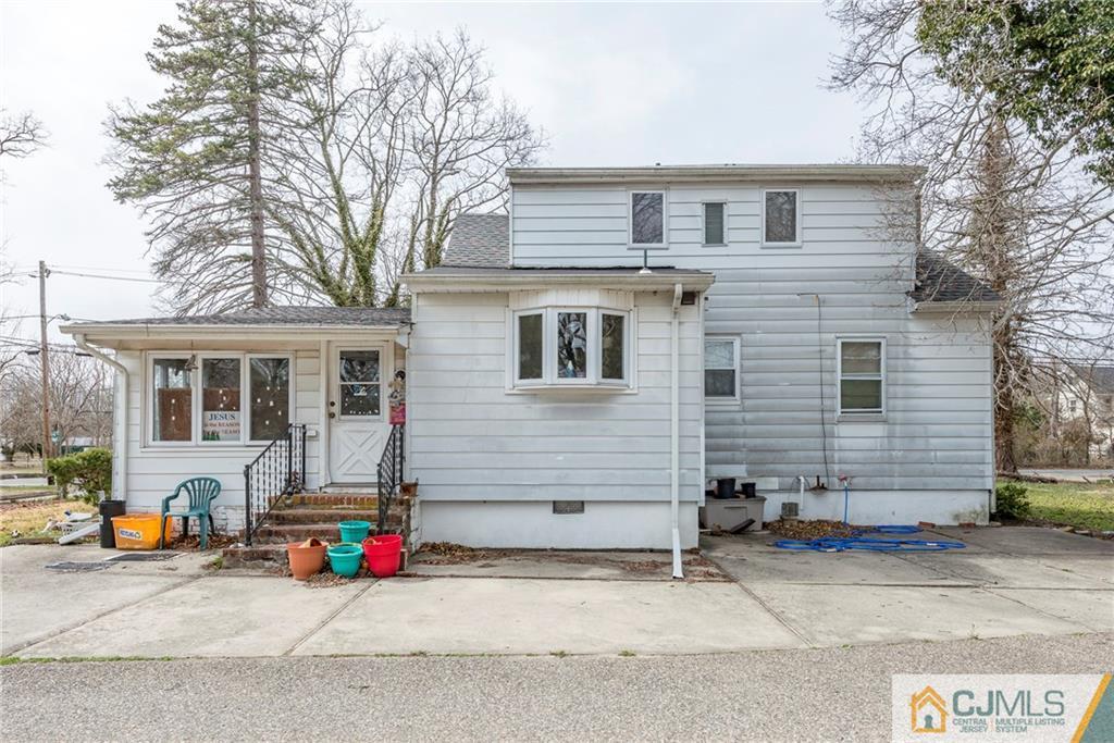 65 Ford Road Howell, NJ 07731 - Photo 18 of 22 a front view of a house with garage