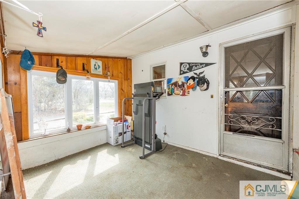 65 Ford Road Howell, NJ 07731 - Photo 3 of 22 a view of an empty room and window