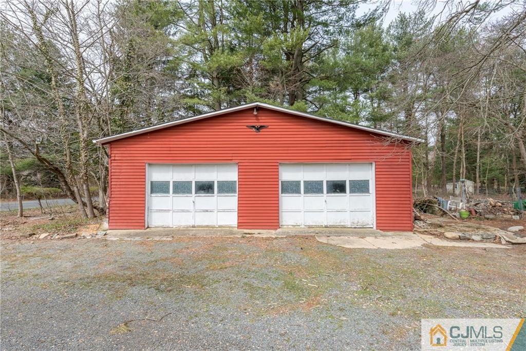 65 Ford Road Howell, NJ 07731 - Photo 22 of 22 a view of a house with a yard and garage