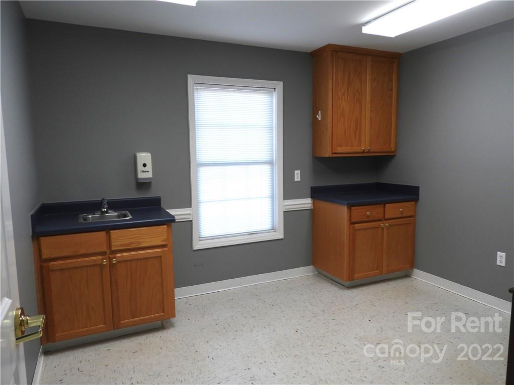 327 West College Avenue Boiling Springs, NC 28152 - Photo 12 of 24 a room with cabinets and window