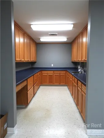 a kitchen with stainless steel appliances granite countertop wooden cabinets a sink and dishwasher