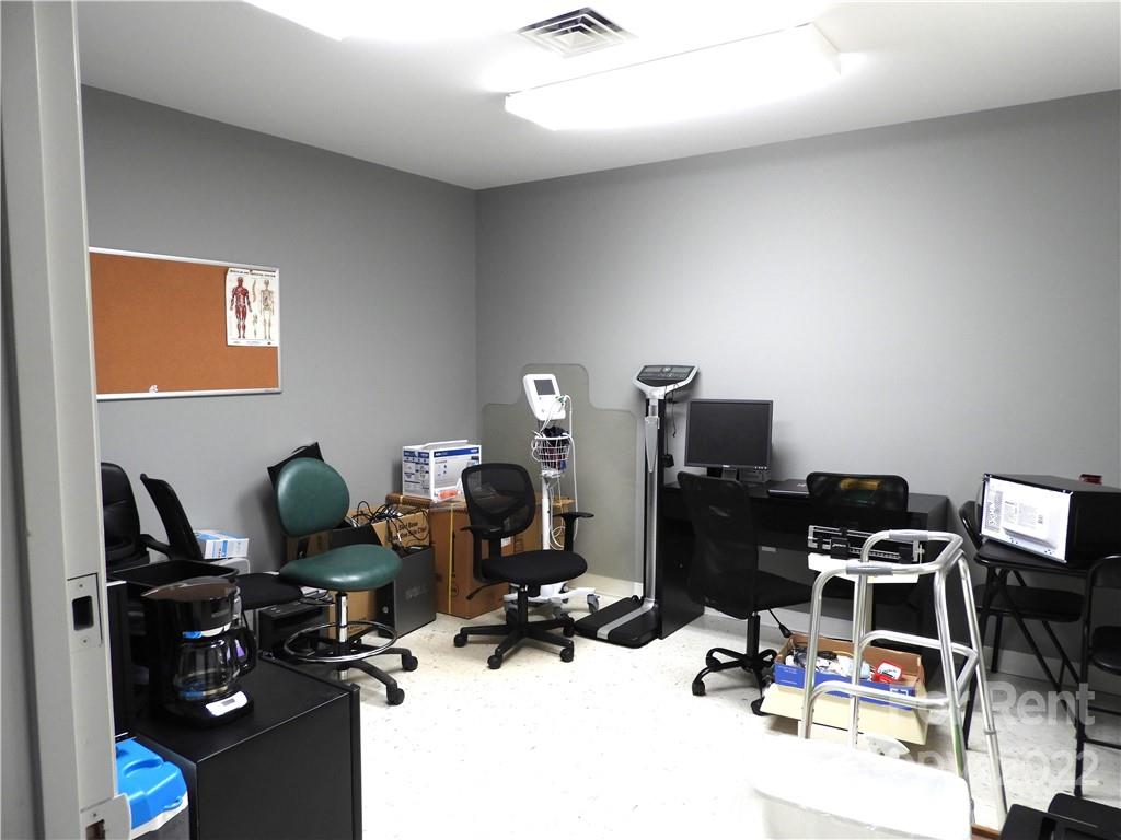 327 West College Avenue Boiling Springs, NC 28152 - Photo 23 of 24 a room with gym equipment and wooden floor