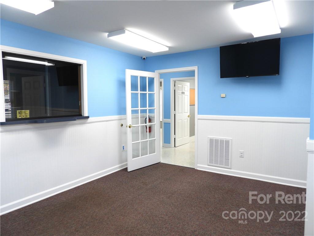 327 West College Avenue Boiling Springs, NC 28152 - Photo 8 of 24 a view of an empty room with a window