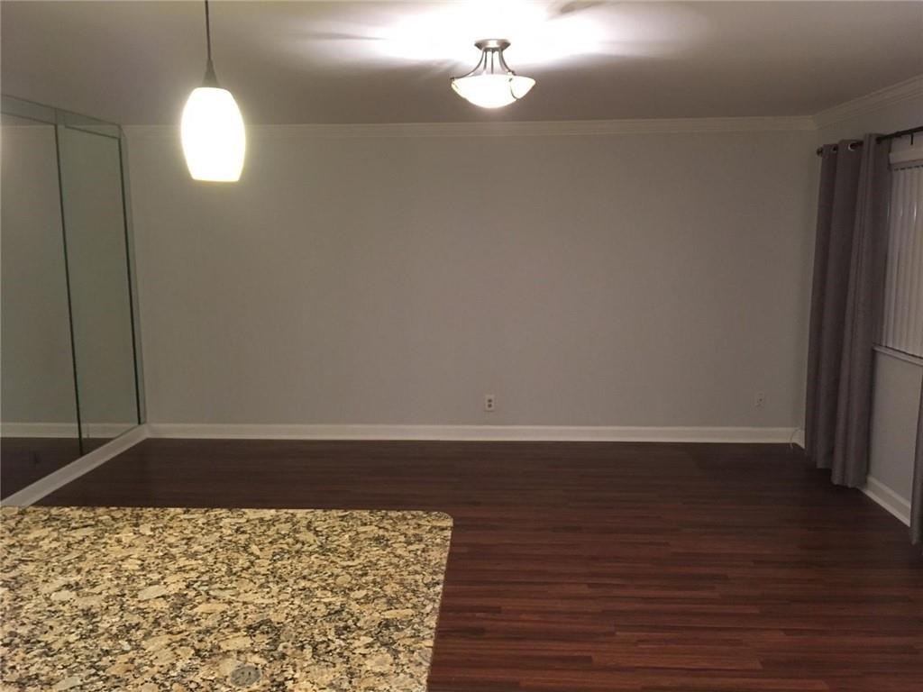 276 Monaco Way Delray Beach, FL 33446 - Photo 3 of 7 a view of a room with wooden floor and chandelier