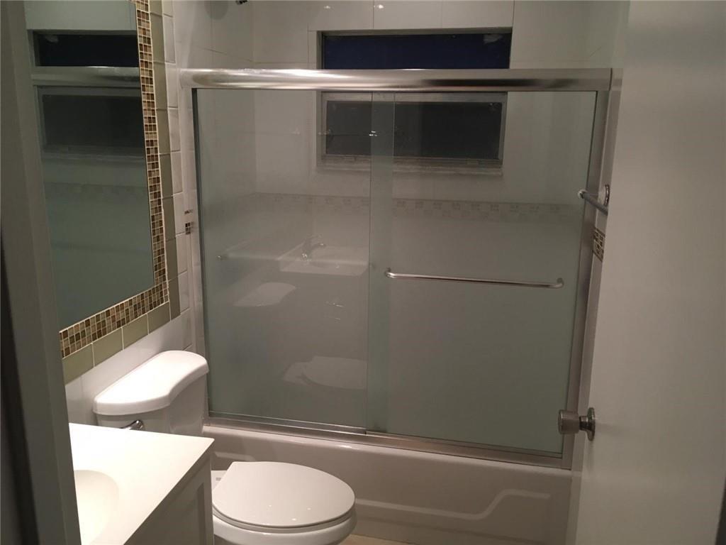 276 Monaco Way Delray Beach, FL 33446 - Photo 5 of 7 a bathroom with a toilet and a shower