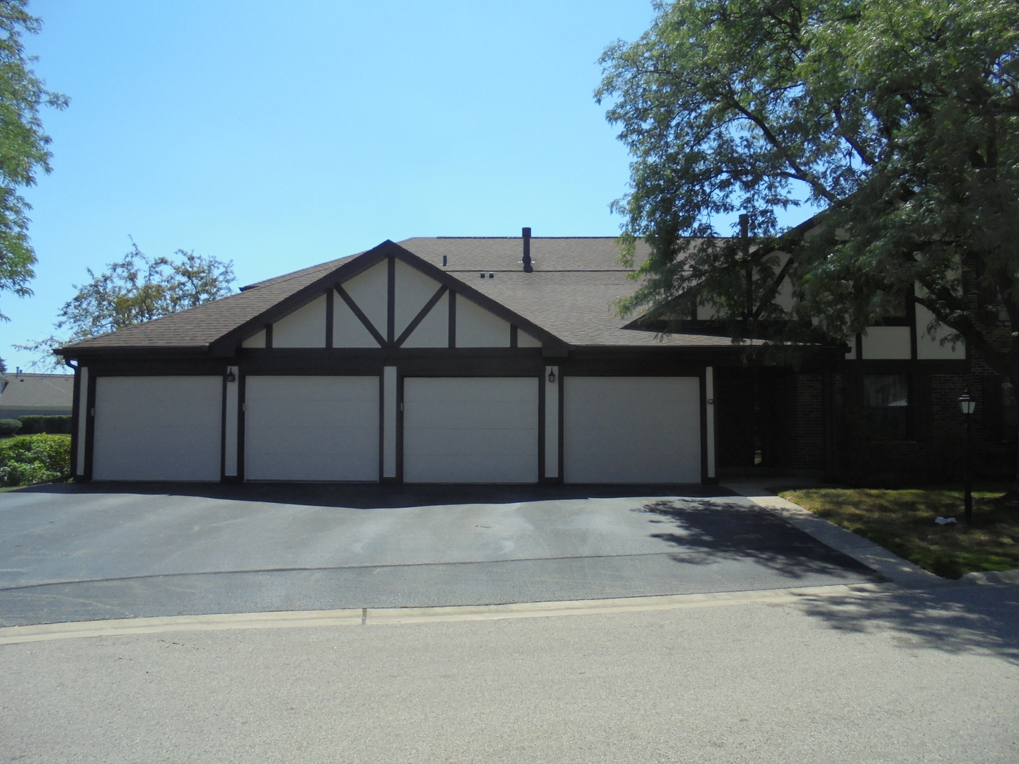 a house that has a tree in front of it