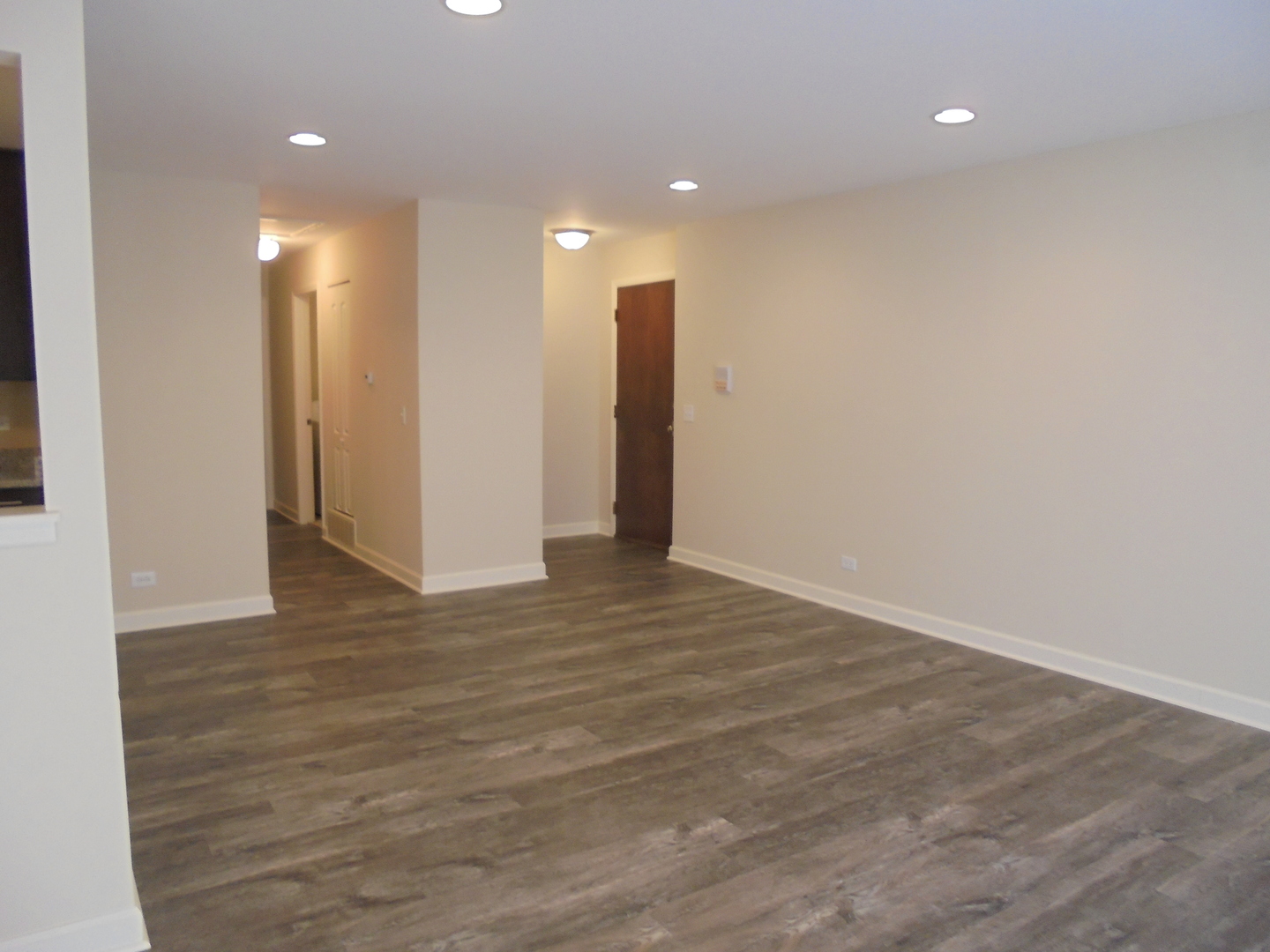 1534 Springview Court, Unit B2 Wheeling, IL 60090 - Photo 11 of 29 a view of an empty room with wooden floor