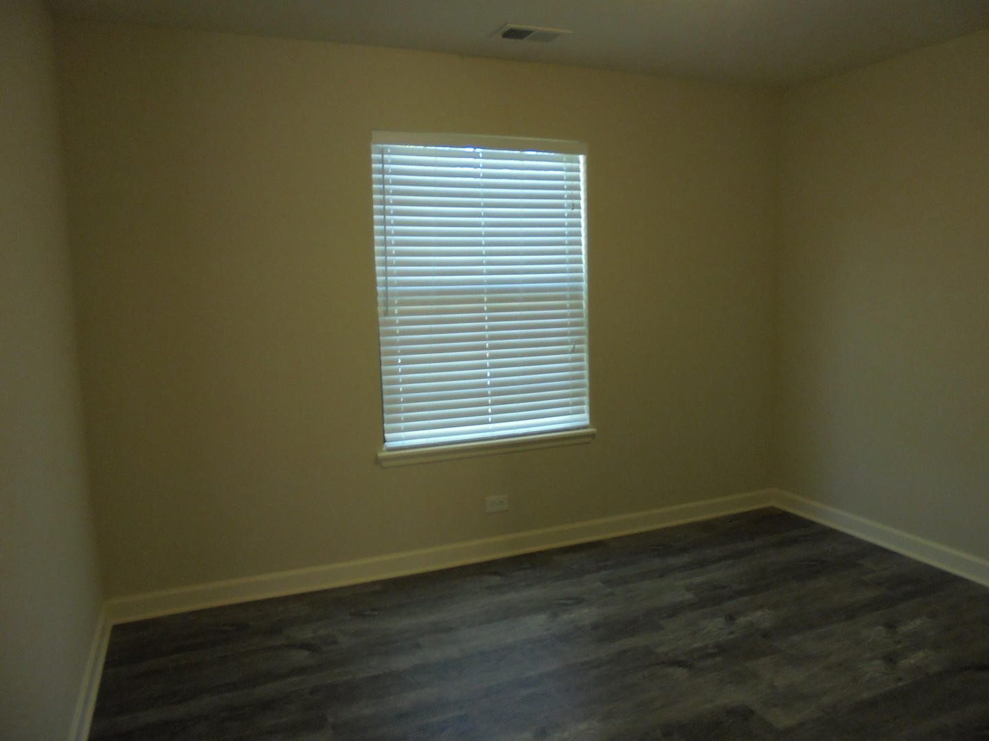 1534 Springview Court, Unit B2 Wheeling, IL 60090 - Photo 21 of 29 a view of a small space with wooden floor and a window