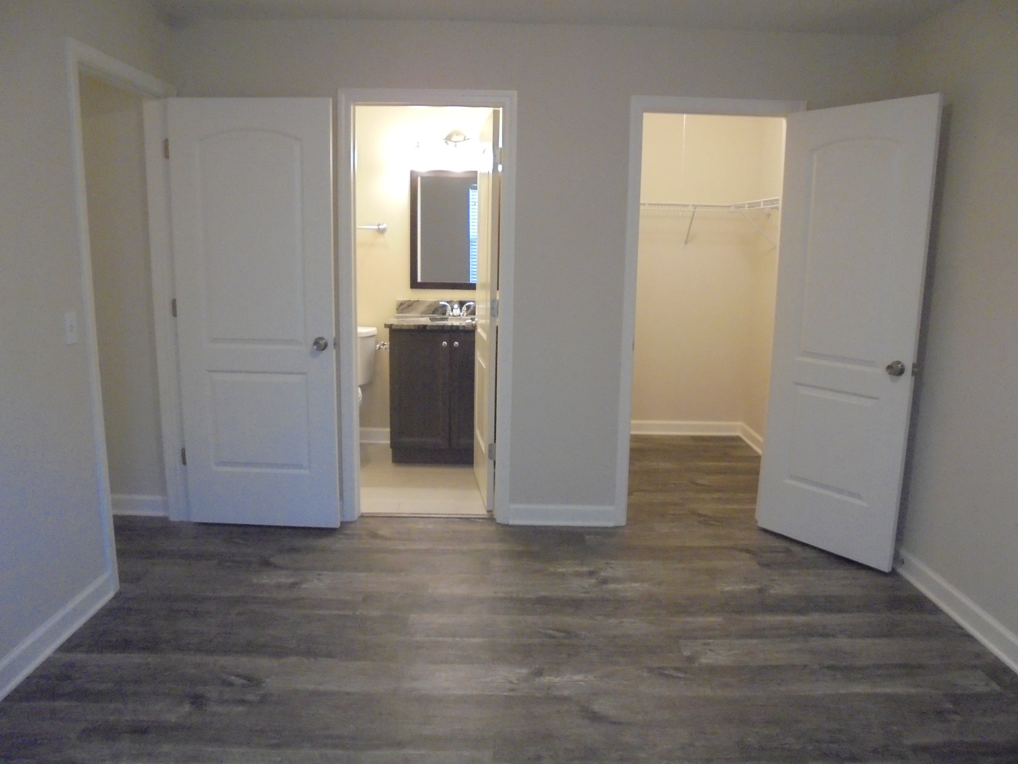 1534 Springview Court, Unit B2 Wheeling, IL 60090 - Photo 23 of 29 a view of a room with wooden floor & closet area