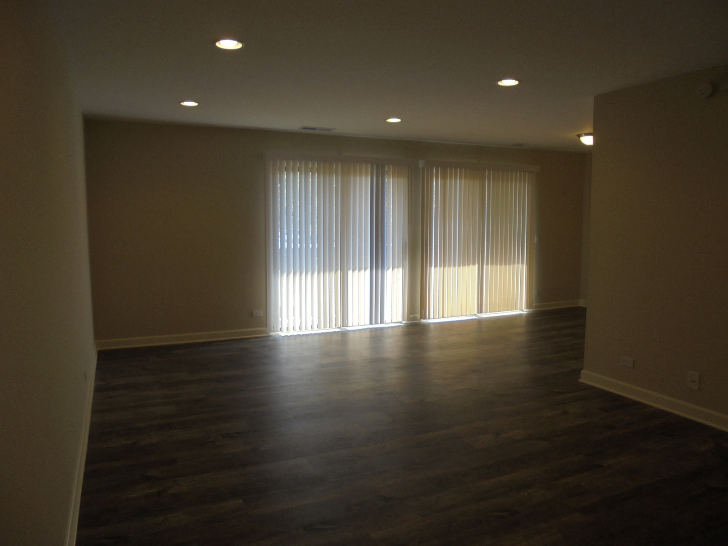 1534 Springview Court, Unit B2 Wheeling, IL 60090 - Photo 7 of 29 a view of wooden floor and windows in a room
