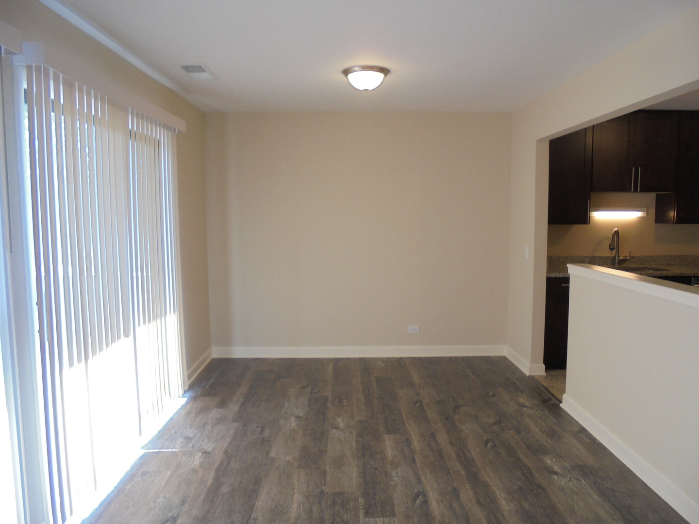 1534 Springview Court, Unit B2 Wheeling, IL 60090 - Photo 9 of 29 a view of a kitchen with wooden floor and electronic appliances