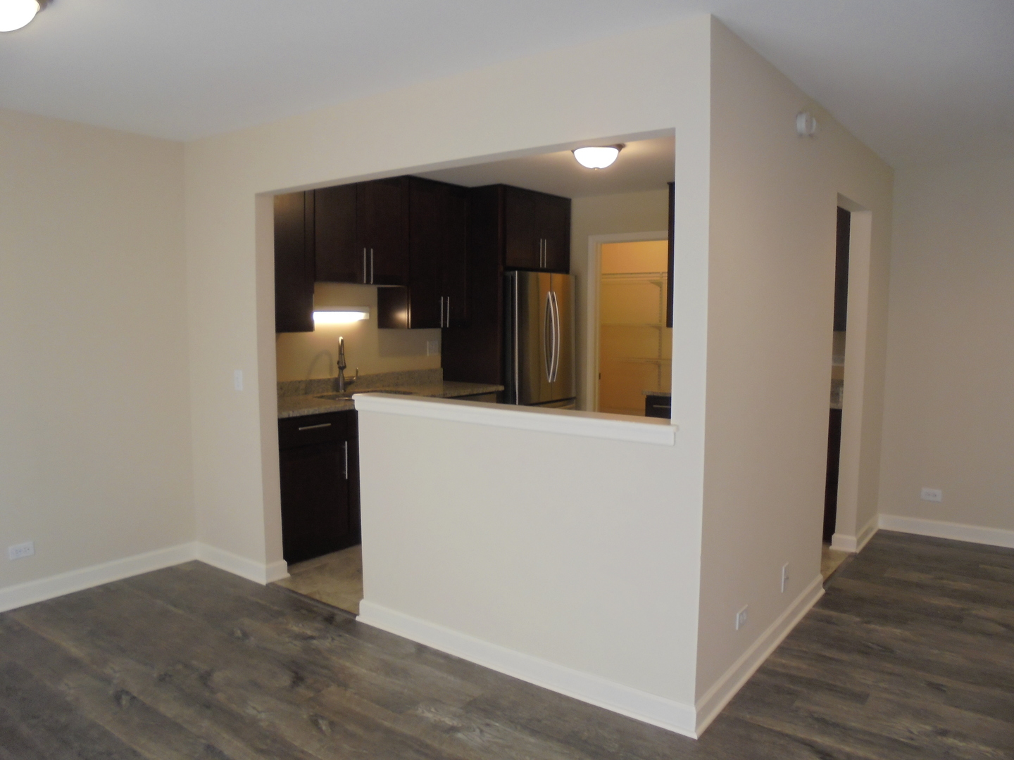 1534 Springview Court, Unit B2 Wheeling, IL 60090 - Photo 10 of 29 a view of hallway with wooden floor