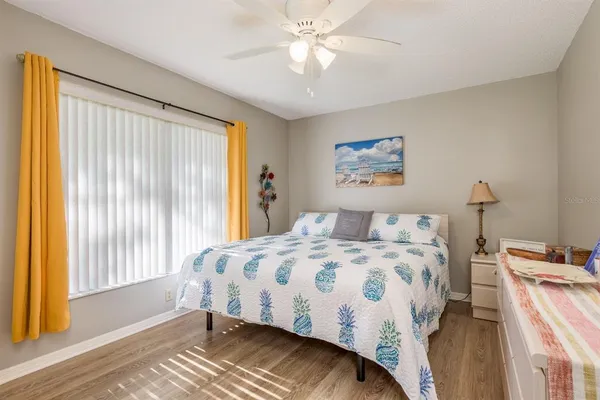 a bedroom with a bed and a television