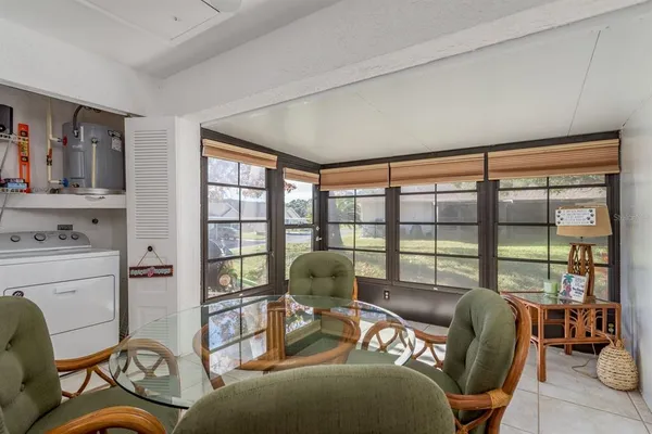 a view of a dining room with furniture window and outside view