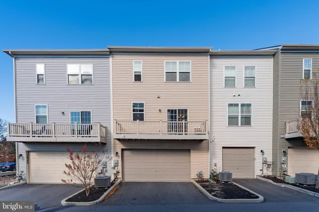 a front view of a house with stairs